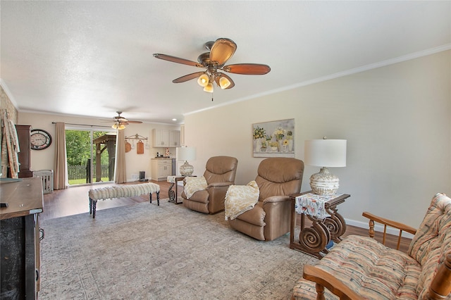 1202 Carroll Dr, Garland, TX 75041 - living area with crown molding, a ceiling fan, wood finished floors, and radiator