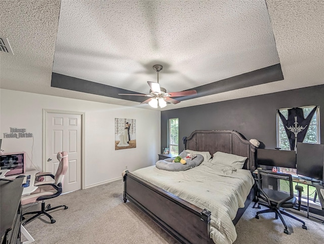 114 Bluebird Ln, Whitehouse, TX 75791 - carpeted bedroom featuring a textured ceiling, a raised ceiling, an office area, and ceiling fan