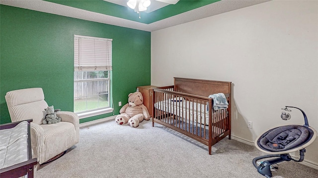 114 Bluebird Ln, Whitehouse, TX 75791 - bedroom with carpet, a nursery area, and a ceiling fan