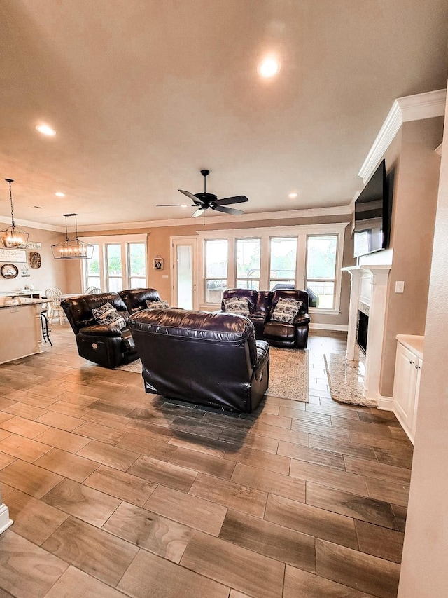 104 St Andrews Ln, Benton, LA 71006 - living room with ornamental molding, wood finished floors, recessed lighting, a fireplace, and a ceiling fan