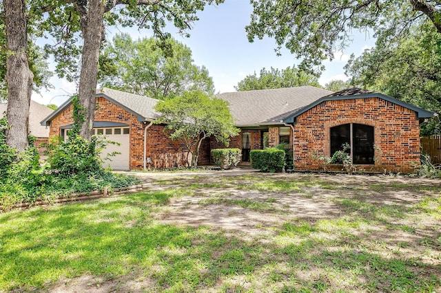 6824 Ridgewood Dr, North Richland Hills, TX 76182 - view of front facade featuring brick siding, a garage, roof with shingles, and a front yard