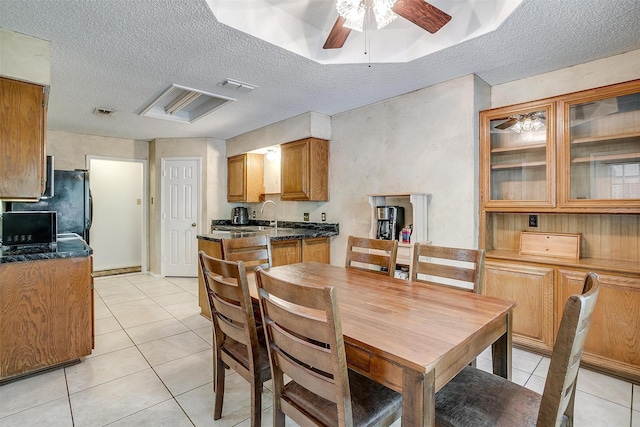 6824 Ridgewood Dr, North Richland Hills, TX 76182 - dining space with a textured ceiling, light tile patterned floors, and a ceiling fan
