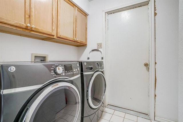 6824 Ridgewood Dr, North Richland Hills, TX 76182 - washroom featuring washing machine and dryer, cabinet space, and light tile patterned floors