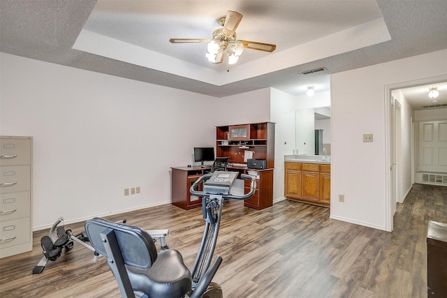 6824 Ridgewood Dr, North Richland Hills, TX 76182 - office space with a raised ceiling, wood finished floors, and ceiling fan