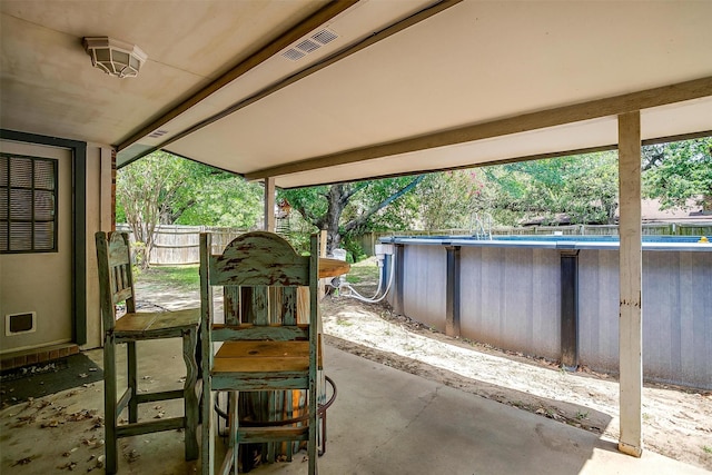 6824 Ridgewood Dr, North Richland Hills, TX 76182 - fenced backyard featuring an outdoor pool and a patio area