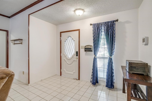 6824 Ridgewood Dr, North Richland Hills, TX 76182 - foyer with a textured ceiling and light tile patterned floors