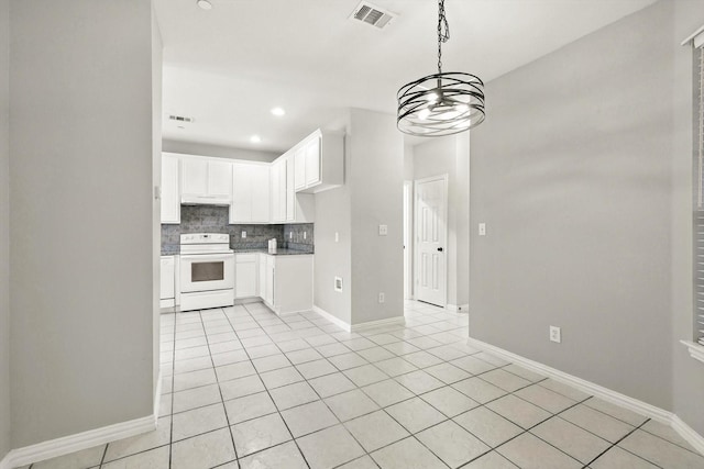 921 Englewood Ln, Plano, TX 75025 - kitchen featuring white electric range oven, light tile patterned floors, tasteful backsplash, white cabinetry, and recessed lighting