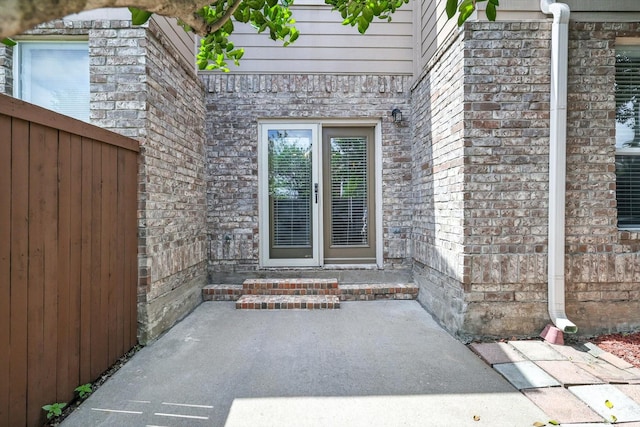 921 Englewood Ln, Plano, TX 75025 - property entrance featuring a patio area and brick siding