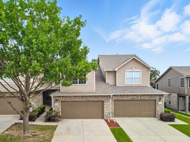 921 Englewood Ln, Plano, TX 75025 - view of front of house with concrete driveway, a garage, a shingled roof, and brick siding