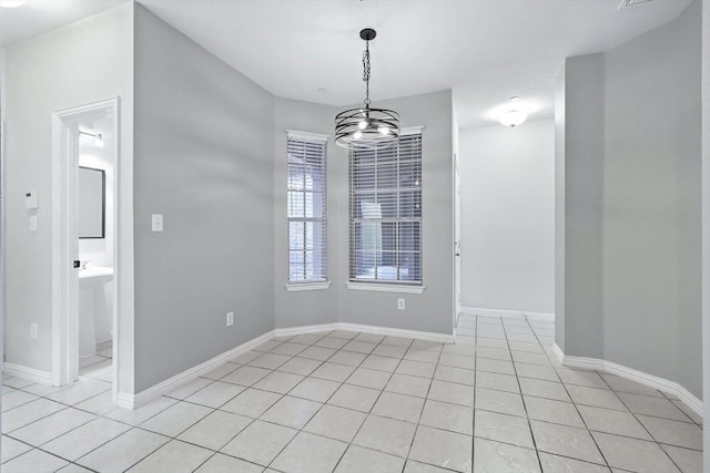921 Englewood Ln, Plano, TX 75025 - empty room with light tile patterned flooring and a chandelier