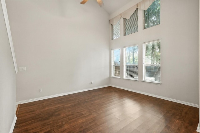 921 Englewood Ln, Plano, TX 75025 - spare room with dark wood-type flooring, ceiling fan, and high vaulted ceiling