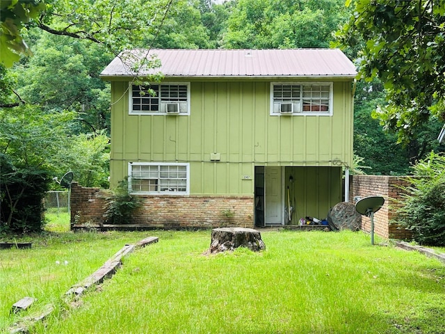267 Washington, Avinger, TX 75630 - view of front facade featuring board and batten siding and a metal roof