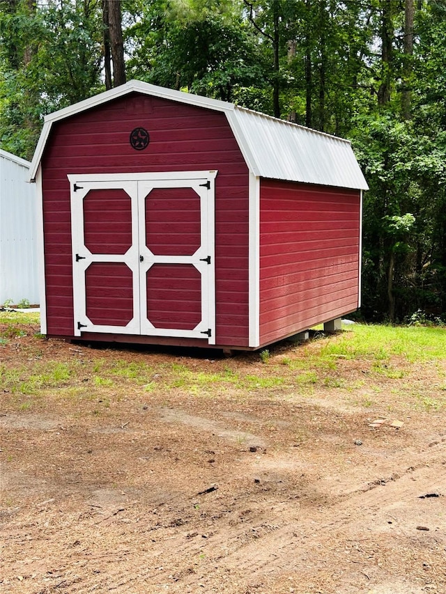 267 Washington, Avinger, TX 75630 - view of shed featuring view of scattered trees