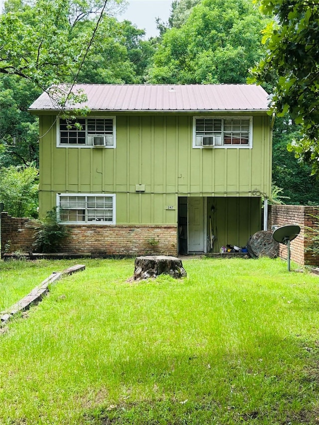 267 Washington, Avinger, TX 75630 - view of front of home with board and batten siding and a metal roof
