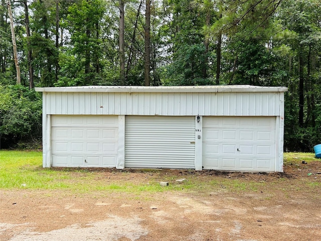 267 Washington, Avinger, TX 75630 - detached garage with view of wooded area