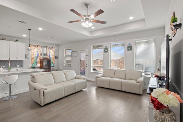 6205 Kent Ln, Celina, TX 76227 - living area with light wood finished floors, a tray ceiling, ceiling fan, and recessed lighting
