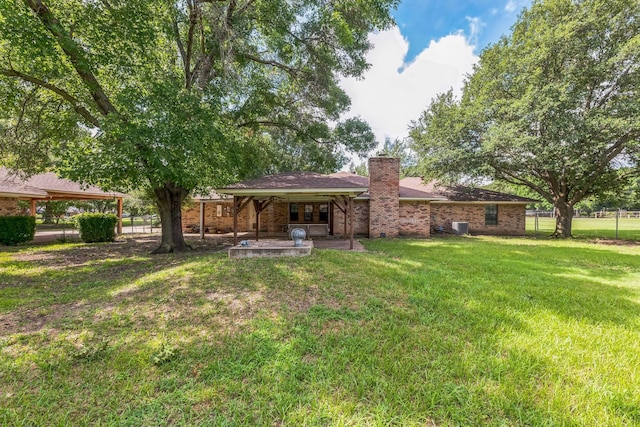 1652 Ernie Ln, Grand Prairie, TX 75052 - back of house featuring a chimney and brick siding