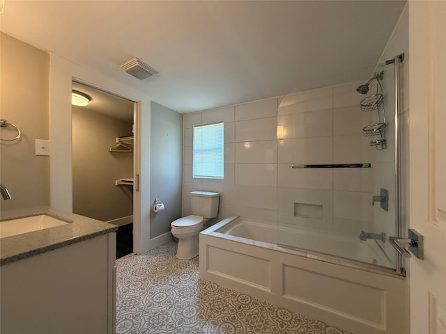 317 W Monterey St, Denison, TX 75020 - bathroom featuring vanity, tub / shower combination, and tile patterned flooring