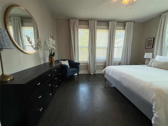 317 W Monterey St, Denison, TX 75020 - bedroom featuring dark wood finished floors and baseboards