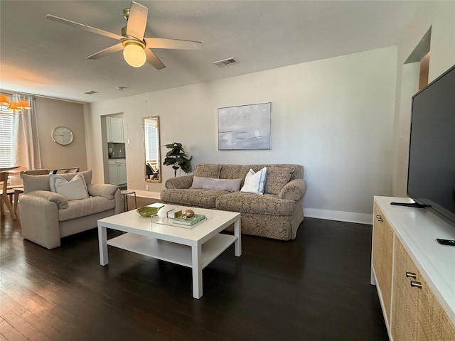 317 W Monterey St, Denison, TX 75020 - living area featuring dark wood finished floors and ceiling fan