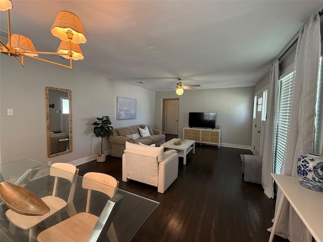 317 W Monterey St, Denison, TX 75020 - living area with dark wood-style flooring, healthy amount of natural light, and ceiling fan