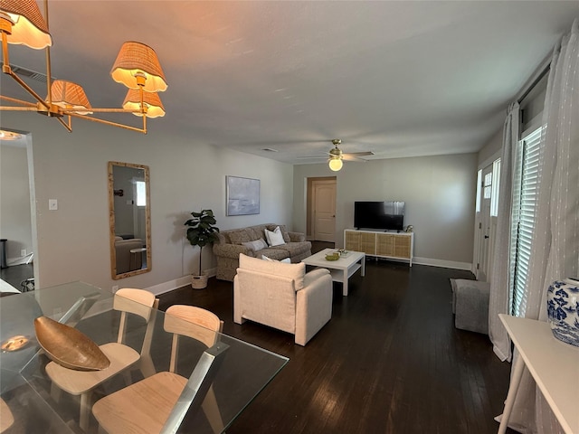 317 W Monterey St, Denison, TX 75020 - living area featuring dark wood finished floors, a ceiling fan, and a chandelier