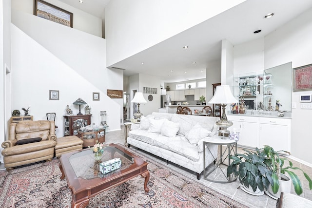 4653 Portrait Ln, Plano, TX 75024 - living area featuring a towering ceiling, recessed lighting, and bar