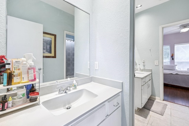 4653 Portrait Ln, Plano, TX 75024 - bathroom with vanity, a textured wall, ensuite bath, and tile patterned floors