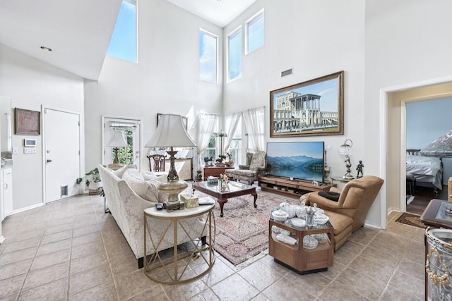 4653 Portrait Ln, Plano, TX 75024 - living room featuring a towering ceiling, healthy amount of natural light, and tile patterned floors