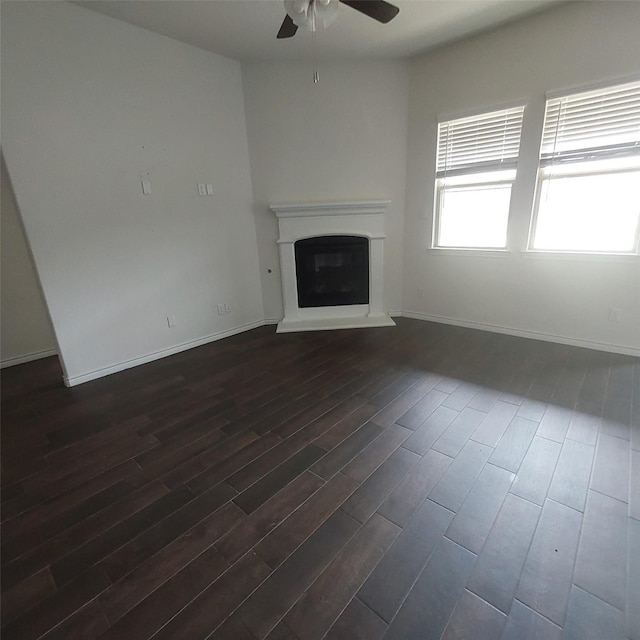 11305 Autry Ridge Ln, Aubrey, TX 76227 - unfurnished living room with ceiling fan, dark wood finished floors, and a glass covered fireplace