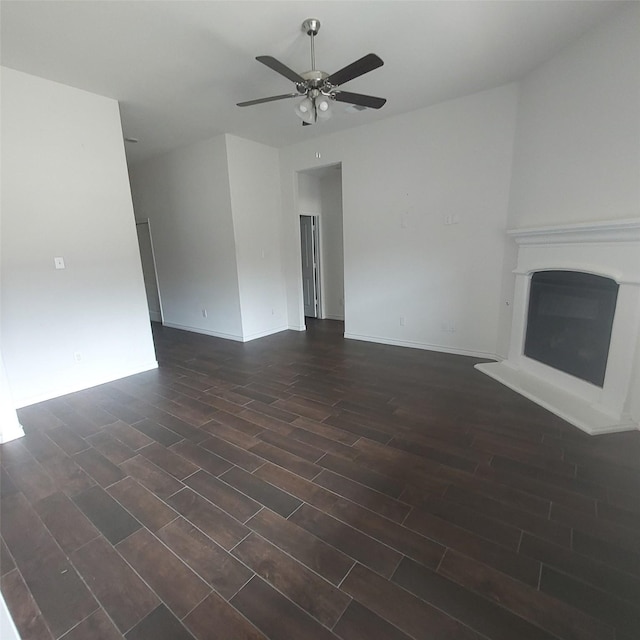 11305 Autry Ridge Ln, Aubrey, TX 76227 - unfurnished living room with dark wood-style floors, a ceiling fan, and a glass covered fireplace