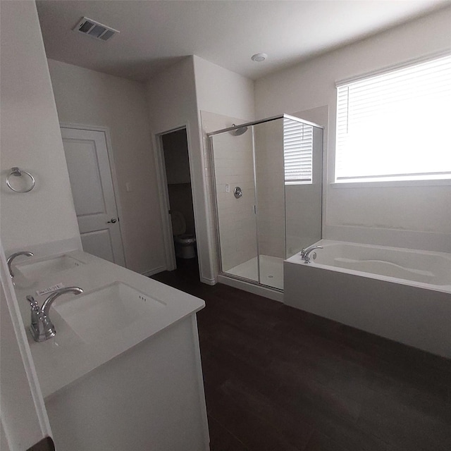 11305 Autry Ridge Ln, Aubrey, TX 76227 - full bathroom featuring a shower stall, a bath, double vanity, and wood finished floors