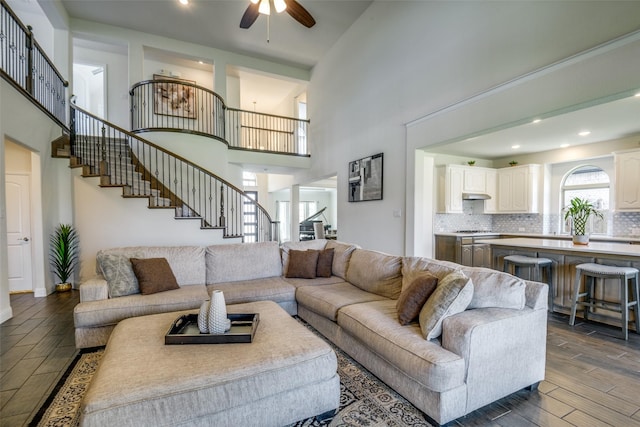 539 Curtiss Dr, Fate, TX 75087 - living area with stairs, a high ceiling, ceiling fan, dark wood finished floors, and recessed lighting