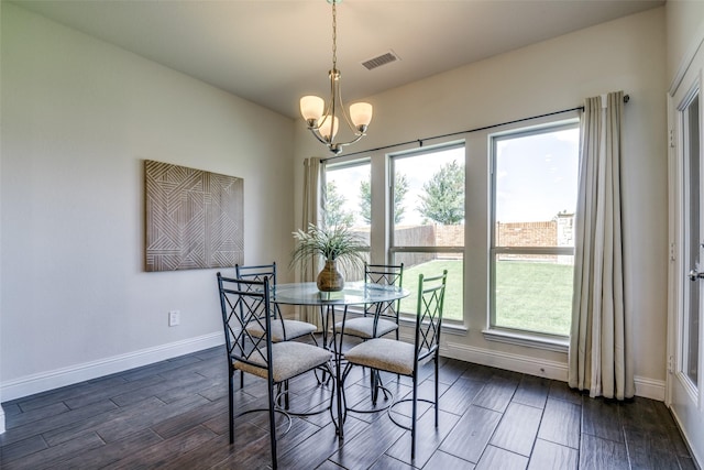 539 Curtiss Dr, Fate, TX 75087 - dining room with a chandelier and dark wood finished floors