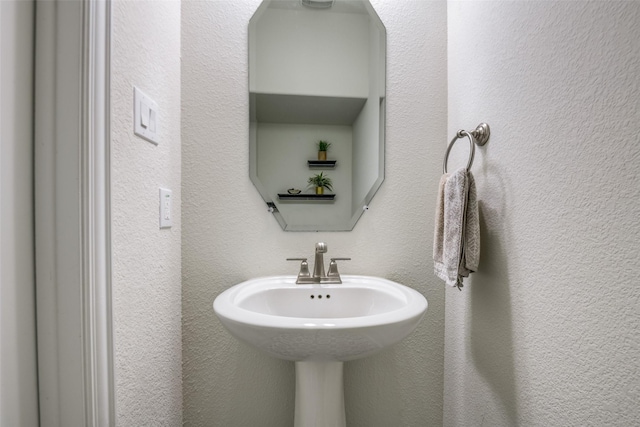 539 Curtiss Dr, Fate, TX 75087 - bathroom with a textured wall and a sink