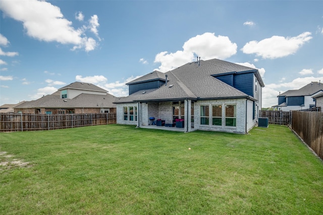 539 Curtiss Dr, Fate, TX 75087 - rear view of house featuring a fenced backyard, roof with shingles, a patio, and brick siding