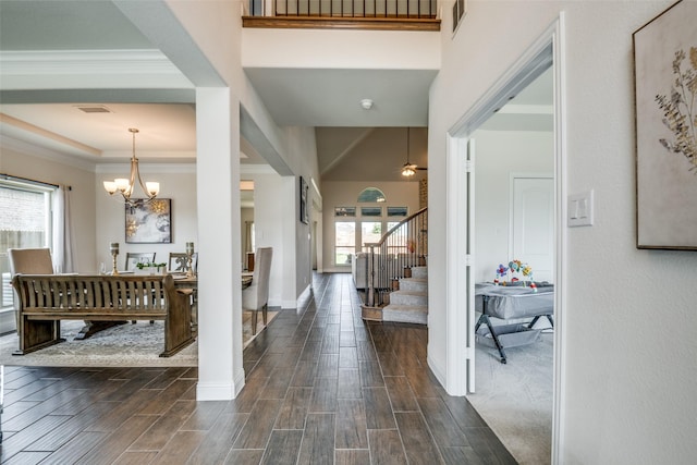 539 Curtiss Dr, Fate, TX 75087 - foyer featuring plenty of natural light, stairway, dark wood finished floors, and crown molding