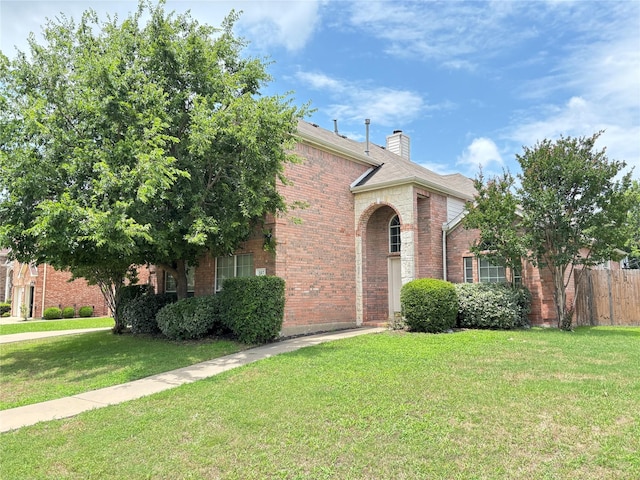 307 Forestridge Dr, Mansfield, TX 76063 - view of front of home featuring brick siding and a chimney