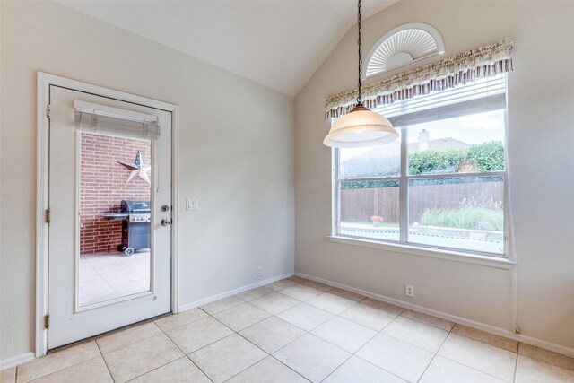1809 N Holland Rd, Mansfield, TX 76063 - unfurnished dining area with healthy amount of natural light, lofted ceiling, and light tile patterned floors