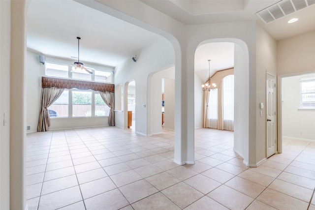 1809 N Holland Rd, Mansfield, TX 76063 - foyer with arched walkways, light tile patterned flooring, a chandelier, a high ceiling, and ceiling fan