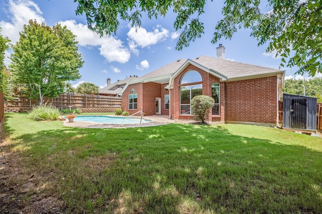 1809 N Holland Rd, Mansfield, TX 76063 - back of property featuring a fenced backyard, a chimney, and brick siding