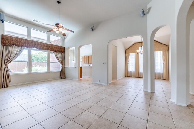 1809 N Holland Rd, Mansfield, TX 76063 - unfurnished living room featuring ceiling fan, plenty of natural light, light tile patterned flooring, arched walkways, and lofted ceiling