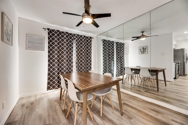 5750 Phoenix Dr Unit 39, Dallas, TX 75231 - dining space featuring a ceiling fan and light wood-type flooring