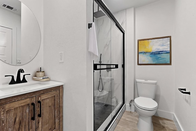 5612 Meadow Nest Dr, Dallas, TX 75236 - bathroom with a marble finish shower, vanity, and wood finished floors