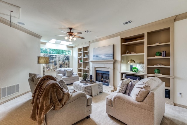 5701 Travis Dr, Frisco, TX 75034 - living room featuring crown molding, ceiling fan, carpet floors, a fireplace with raised hearth, and built in shelves
