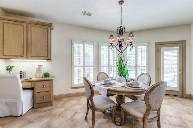 5701 Travis Dr, Frisco, TX 75034 - dining room with a chandelier, light tile patterned flooring, and built in desk