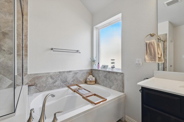 1129 Berrydale Dr, Northlake, TX 76226 - full bath with vanity, a garden tub, and vaulted ceiling