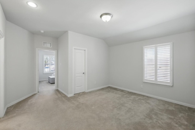 1129 Berrydale Dr, Northlake, TX 76226 - spare room featuring carpet floors and vaulted ceiling