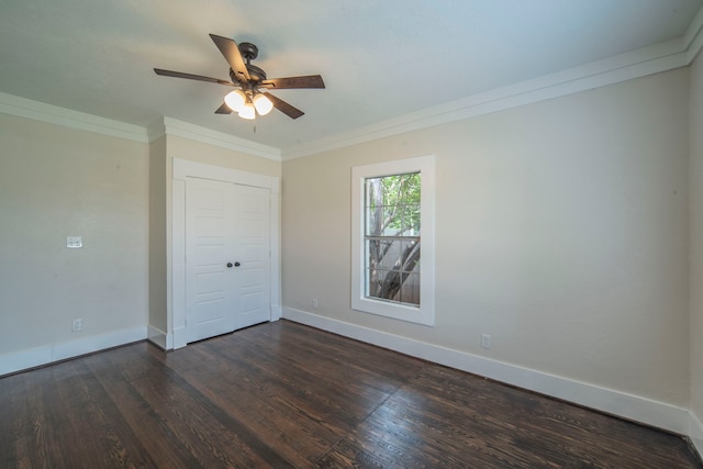 1504 E Rosedale St, Fort Worth, TX 76104 - unfurnished bedroom with dark wood-style flooring, crown molding, a ceiling fan, and a closet