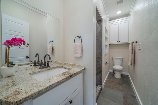 1504 E Rosedale St, Fort Worth, TX 76104 - bathroom featuring stone tile floors, vanity, and a shower